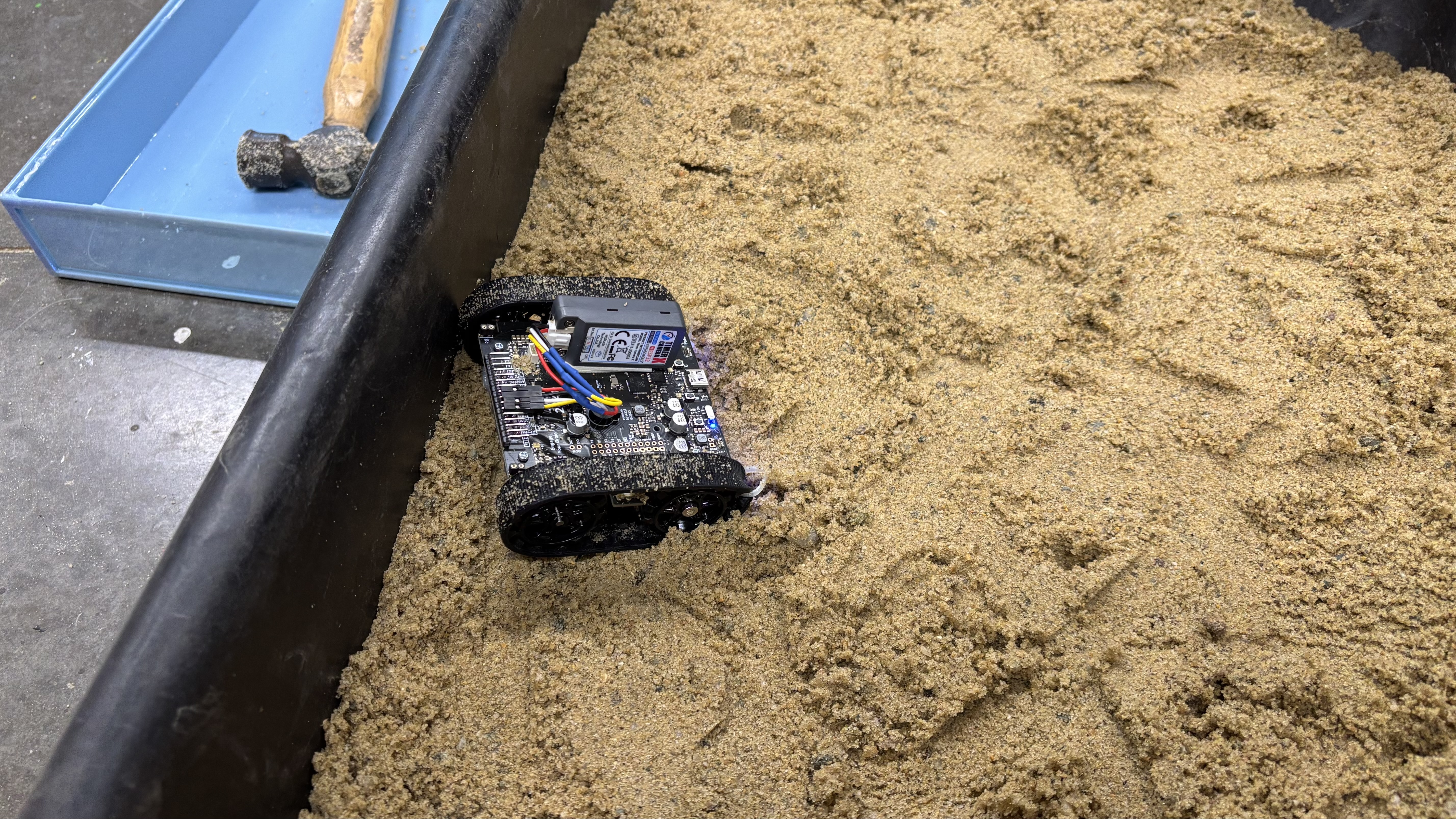 A photo of our rover driving in the sand